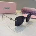 Miu Miu Lightweight Rimless Silver Lens Sunglasses for Women